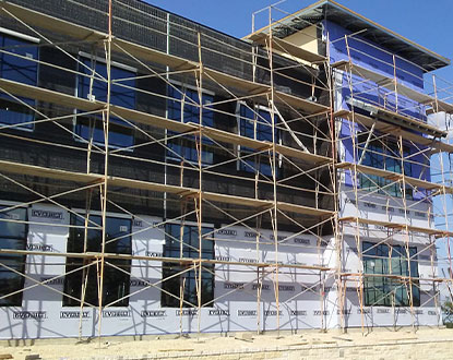 STUCCO OVER STONE/SIDING